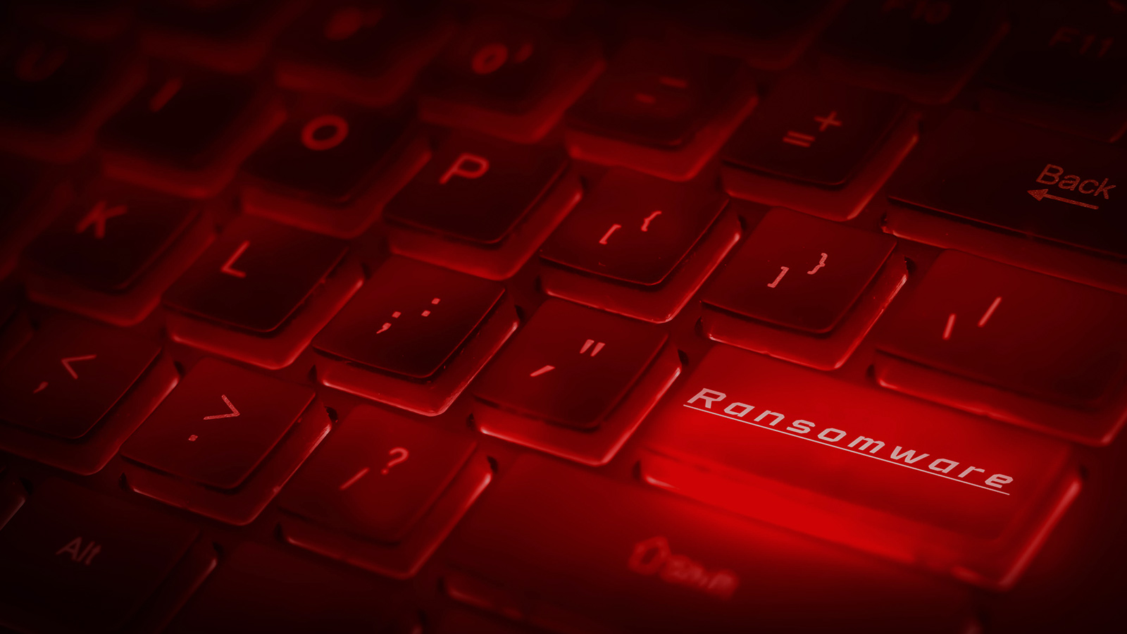 Computer keyboard in dark red with enter key as the word Ransomware in white