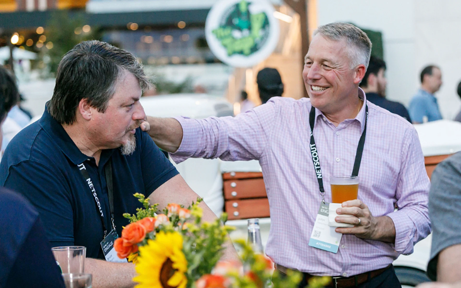 Two colleagues chatting over drinks