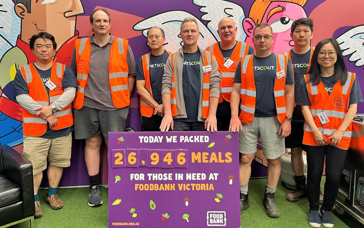 NETSCOUT volunteers in orange work vests at Foodbank Victoria