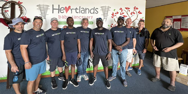 NETSCOUT volunteers in NETSCOUT t-shirts at the Heartlands Baby Sanctuary