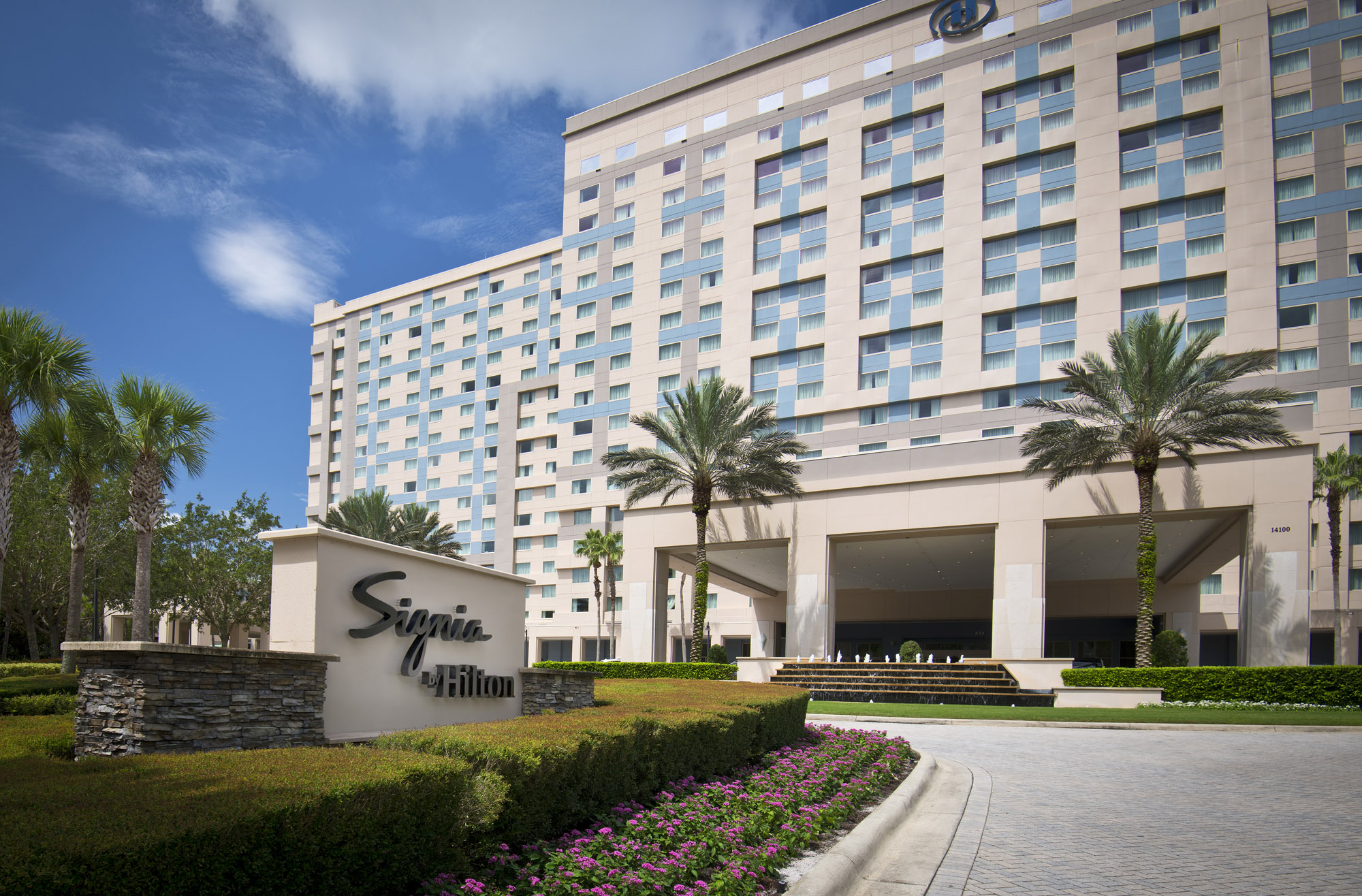 Exterior driveway and signage of Signia by Hilton Orlando