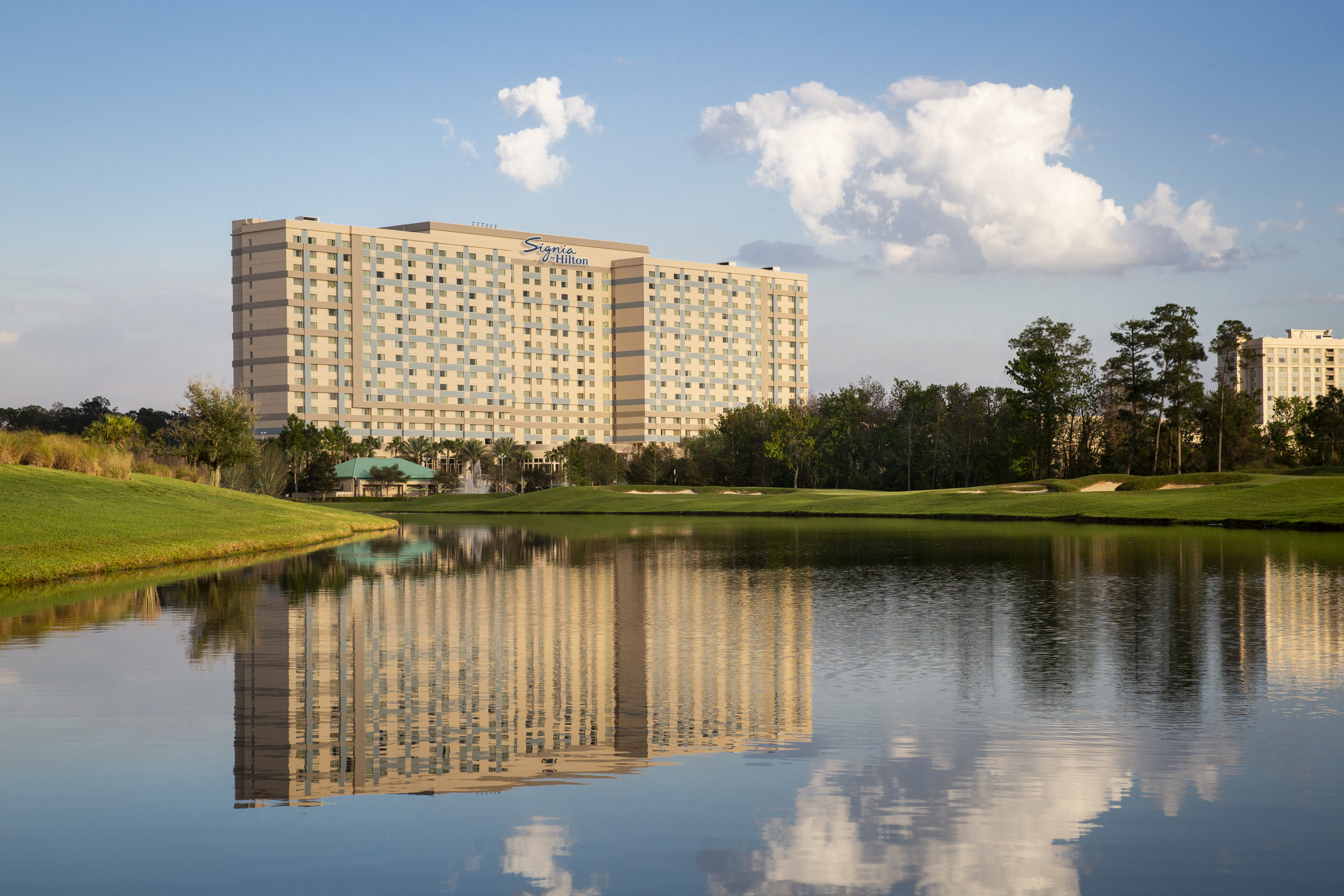 View of Signia by Hilton Orlando from across a pond.