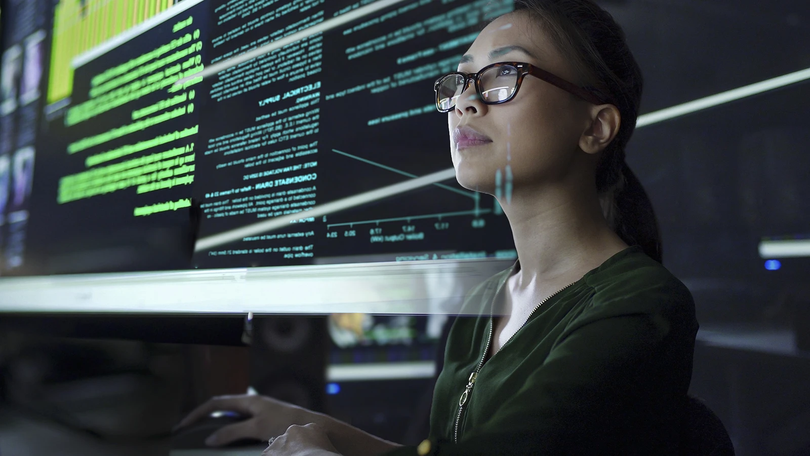 Woman with glass reviewing smart data