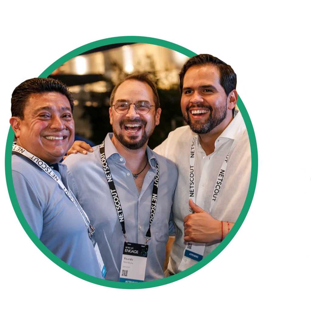 Three men smiling and laughing at the camera