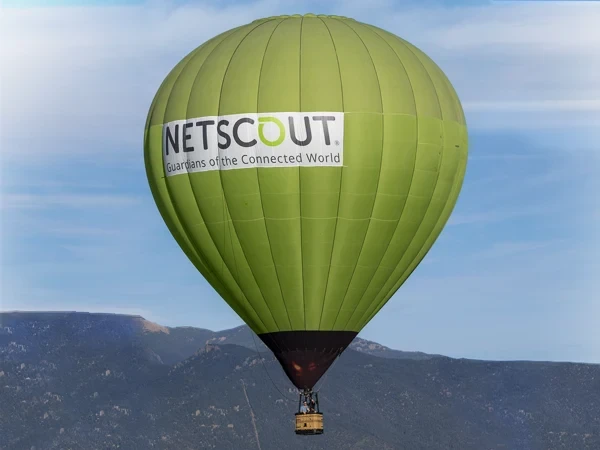 Green NETSCOUT hot air balloon in Colorado