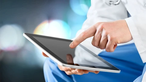 Medical professional using tablet