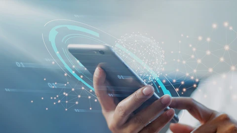 Hand holding mobile phone with abstract security overlays