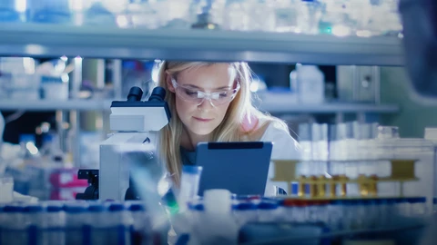 Pharmacist looking at her workstation