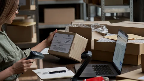 Girl scanning a box on her desk