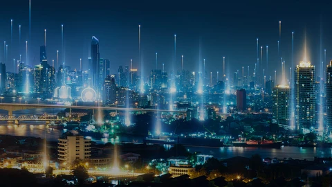 View of cityscape from up high with dark blue shaded overlay and lines of light coming up from the center