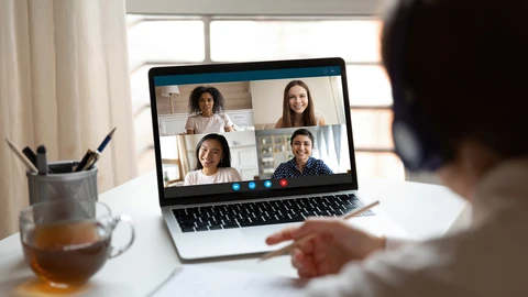 Person on laptop in Video Meeting with 4 people