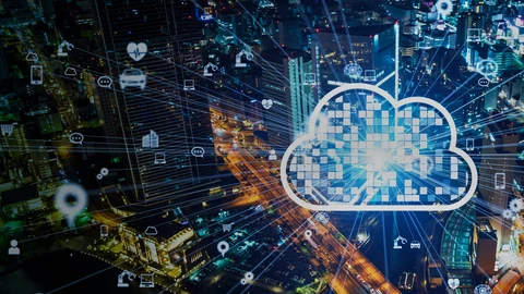 Pixilated Cloud above a city at night, with lines exploding from outside depicting different types of services (hospital,homes,construction)