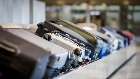 Luggage on airport conveyor belt