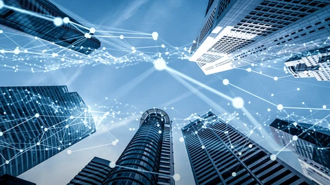 Looking up at skyscrapers depicting radio wave lines traveling between them