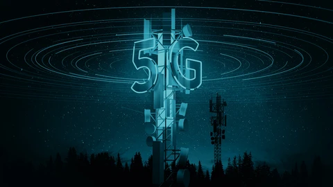 Cell tower lite up in the night with 5G in the middle