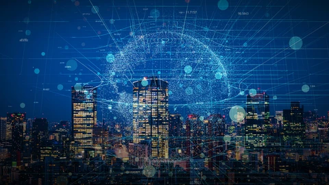 Night time view of a big city skyline with digital earth in background