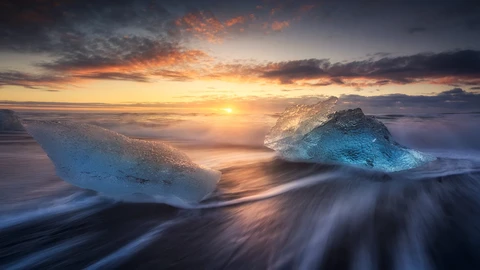 Sunset with waves and ice