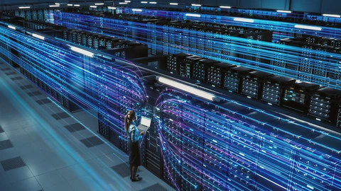 Person on laptop working with servers