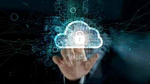 Hand touching lock on cloud to represent cyber resilience 