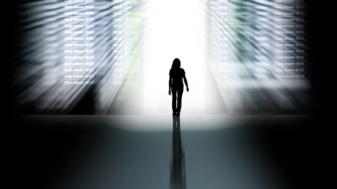 silhouette of a dark figure in a white hallway