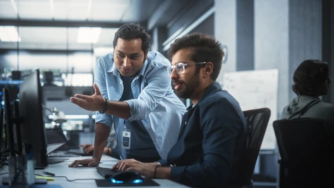 IT team members working together at a desk
