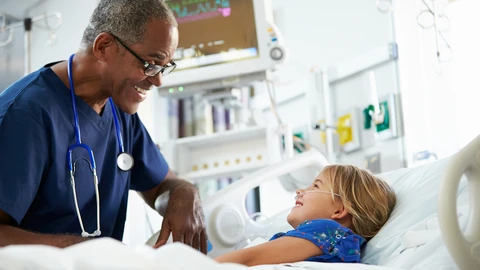 Doctor and young patient smiling