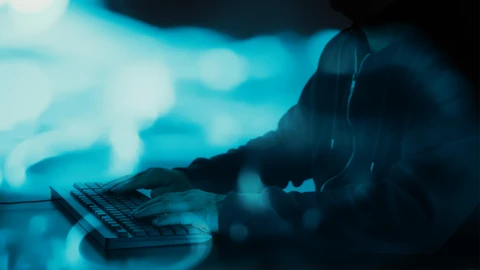 Man in Black Hoodie Typing on Keyboard