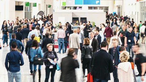 People walking around tradeshow floor
