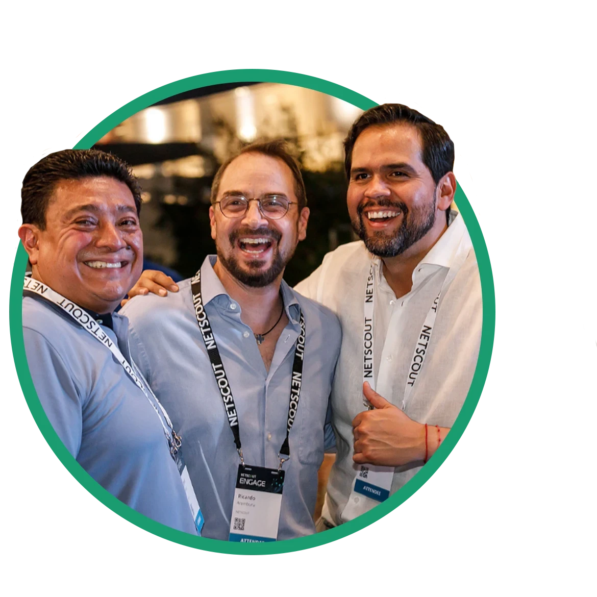 Three men smiling and laughing at the camera