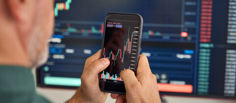 Person looking at data chart on phone