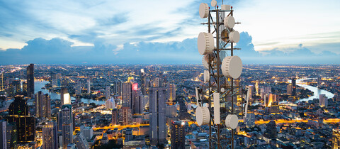 Service Provider Tower in Front of Cityscape