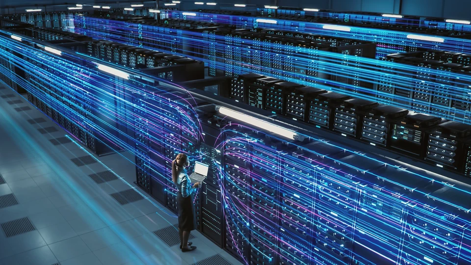 Person on laptop working with servers