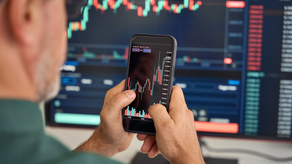 Person looking at data chart on phone