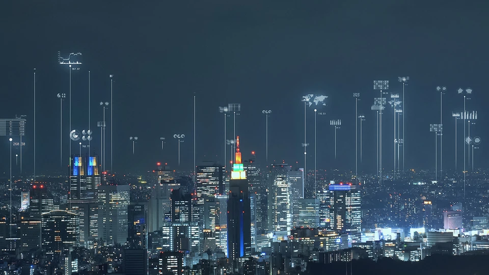skyscrapers at night with applications being shown in the sky