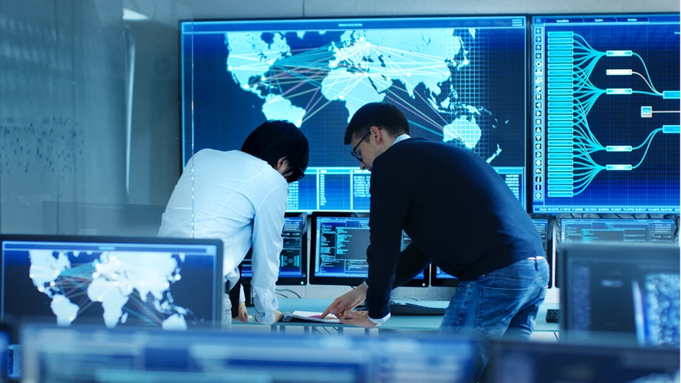 2 men looking at monitor