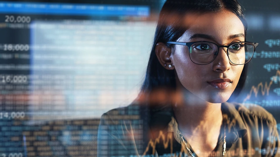 Woman wearing glass with data in the background